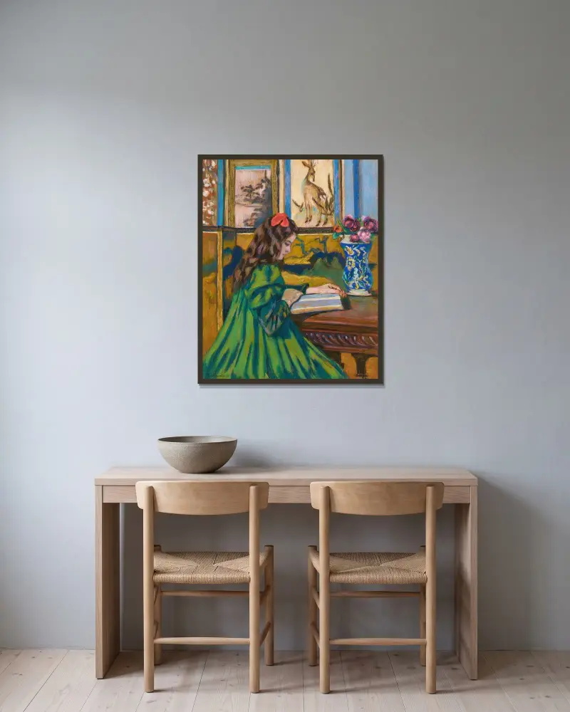 Madeleine Guillaumin läsande av Armand Guillaumin inramad på en vägg