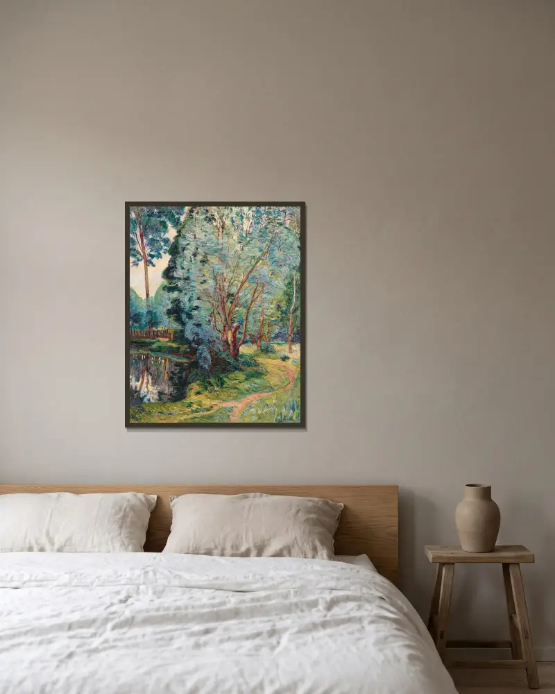 Skogslandskap vid dammen av Armand Guillaumin inramad på en vägg