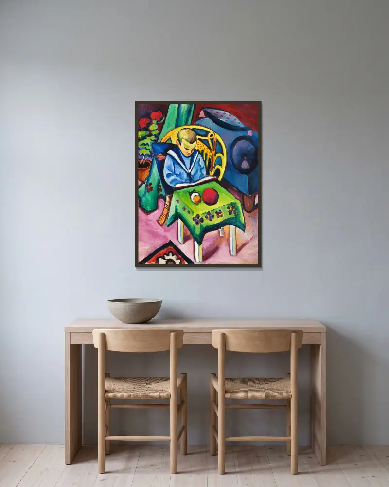 Chlapec s knihou a hračkami, August Macke v rámu na stěně