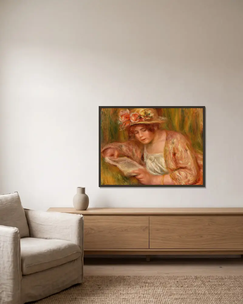 Andrée mit Hut, lesend von Pierre-Auguste Renoir gerahmt an einer Wand
