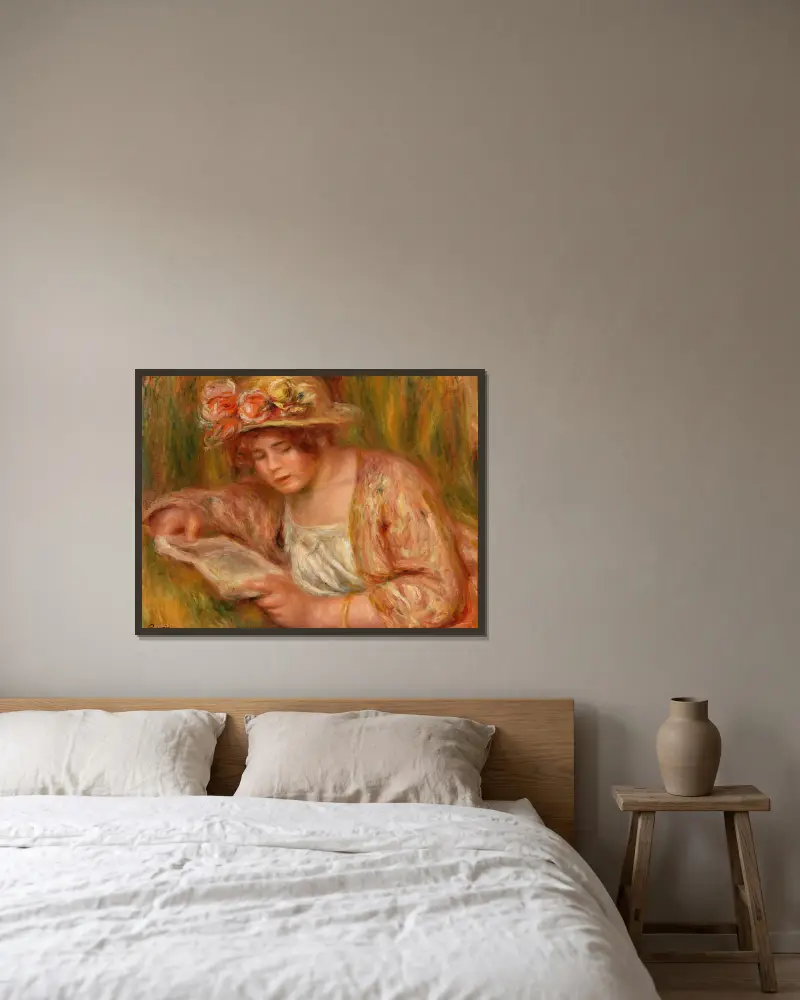 Andrée mit Hut, lesend von Pierre-Auguste Renoir gerahmt an einer Wand
