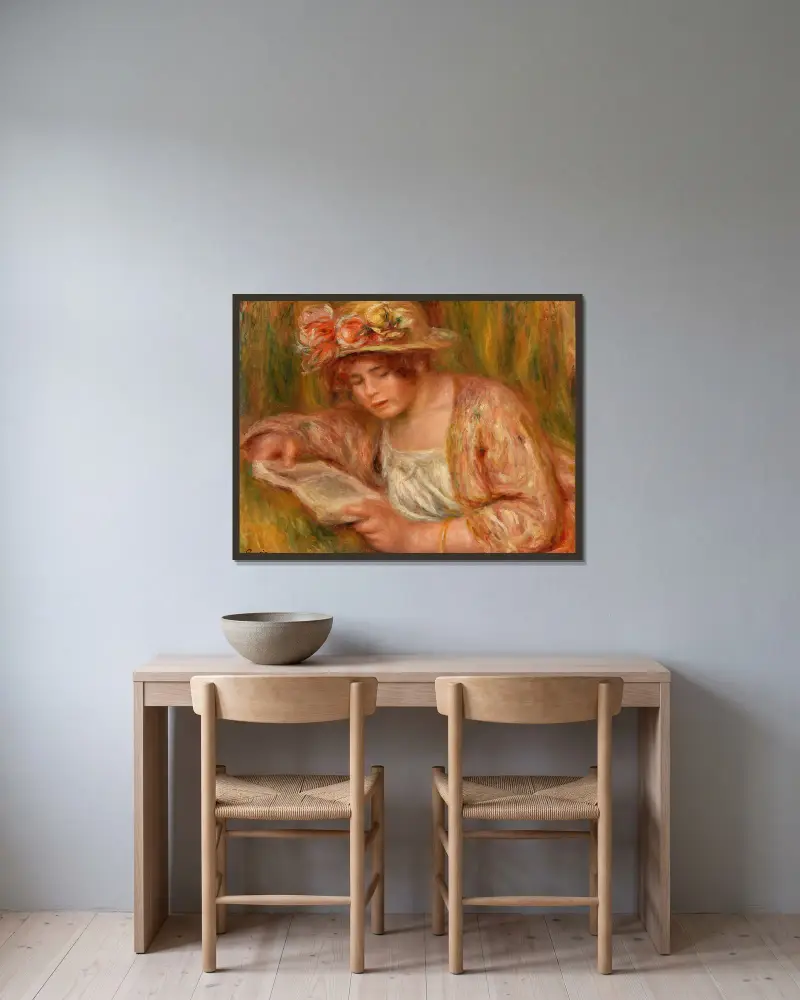 Andrée mit Hut, lesend von Pierre-Auguste Renoir gerahmt an einer Wand
