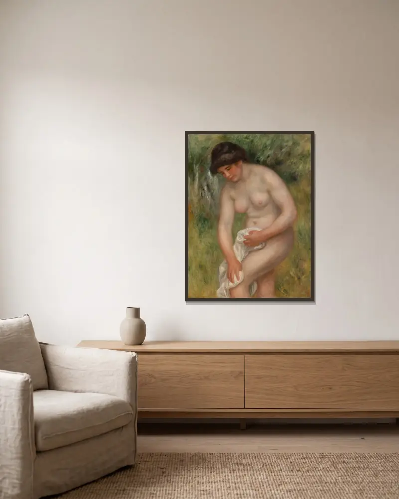 Badende Frau, die sich abtrocknet von Pierre-Auguste Renoir gerahmt an einer Wand