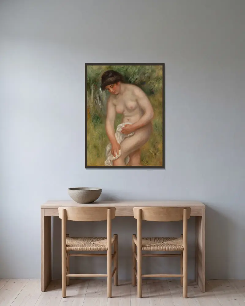 Badende Frau, die sich abtrocknet von Pierre-Auguste Renoir gerahmt an einer Wand