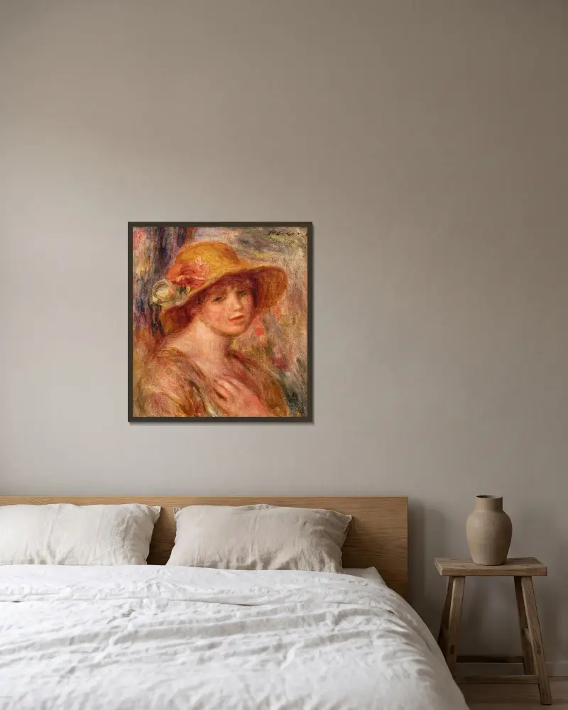 Femme au chapeau de paille av Pierre-Auguste Renoir inramad på en vägg