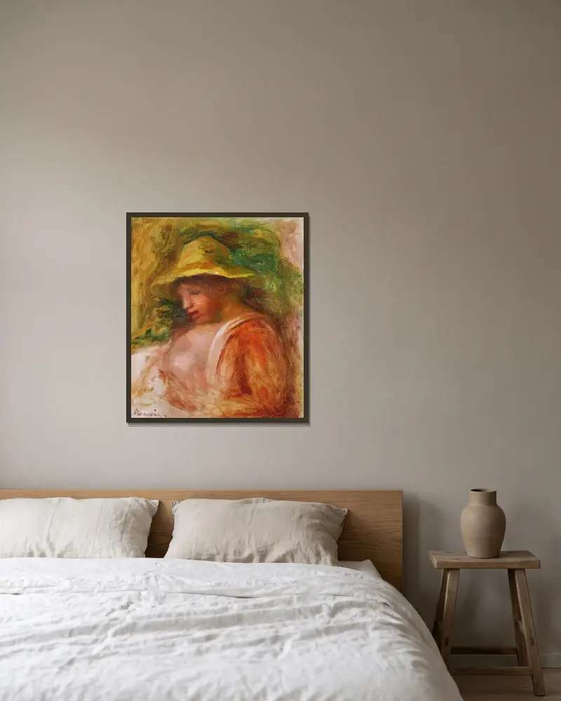 Femme Au Chapeau av Pierre-Auguste Renoir inramad på en vägg