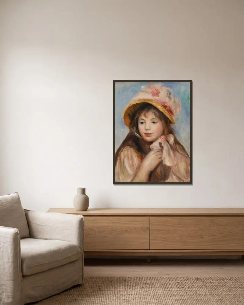 Girl with Pink Bonnet (Jeune fille au chapeau rose) av Pierre-Auguste Renoir inramad på en vägg