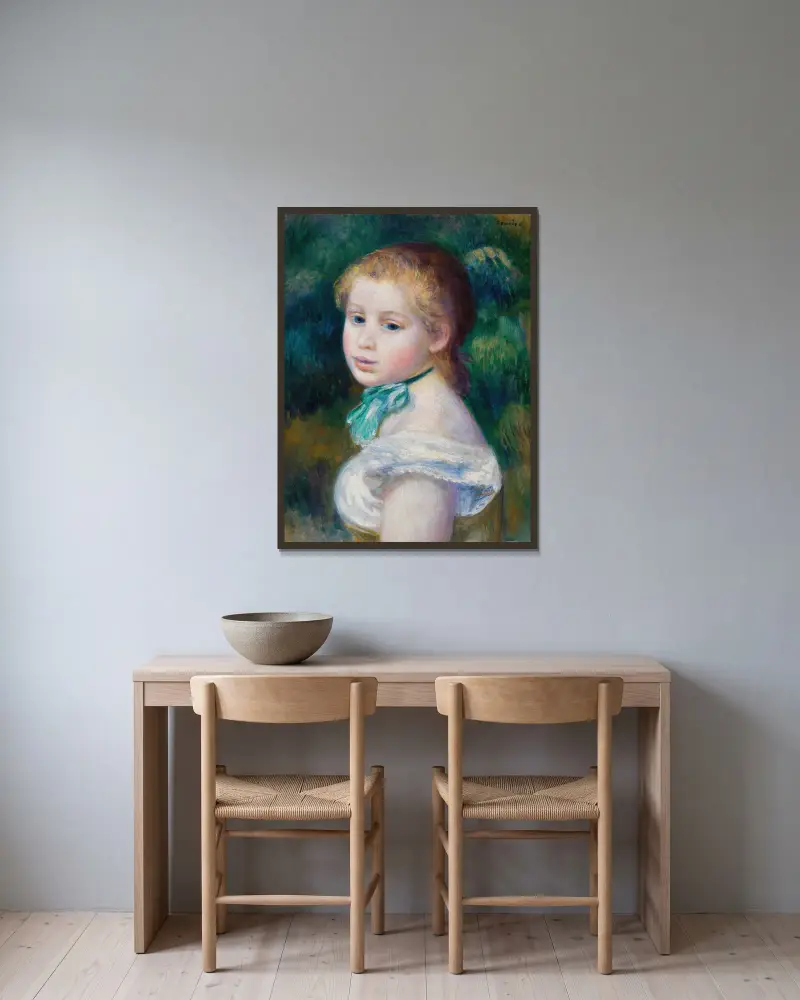 Ung flickas huvud av Pierre-Auguste Renoir inramad på en vägg