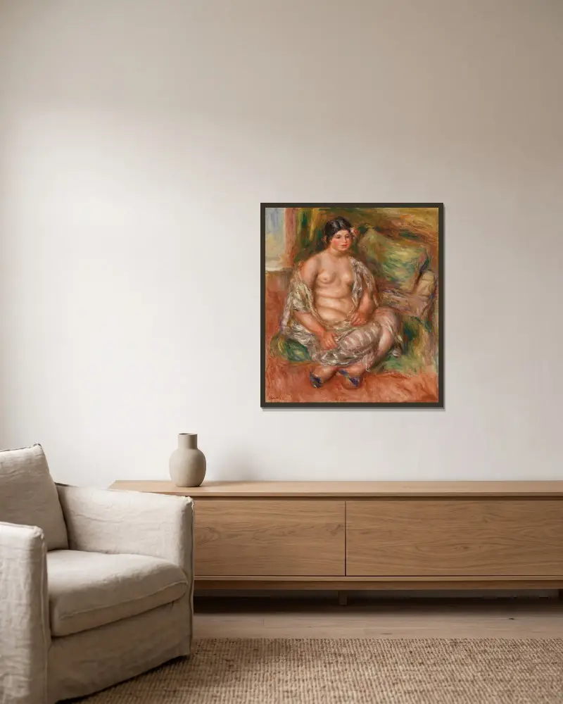 Sitzende Odaliske von Pierre-Auguste Renoir gerahmt an einer Wand