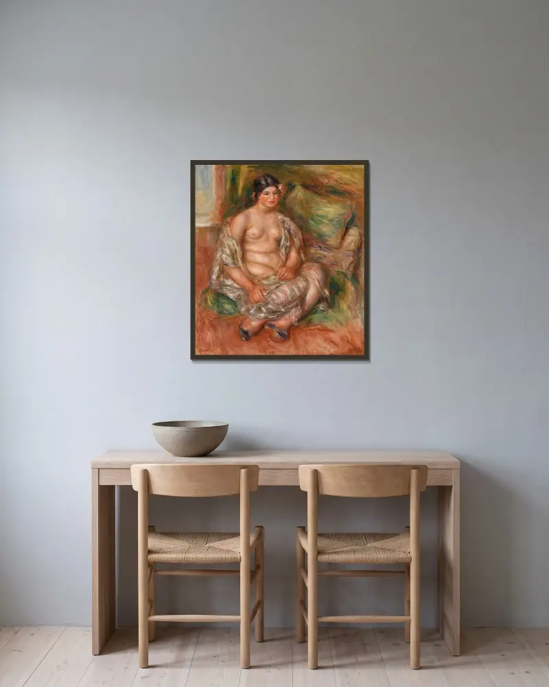 Sitzende Odaliske von Pierre-Auguste Renoir gerahmt an einer Wand