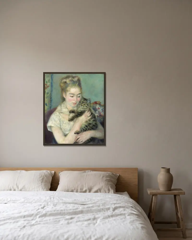 Woman with a Cat av Pierre-Auguste Renoir inramad på en vägg