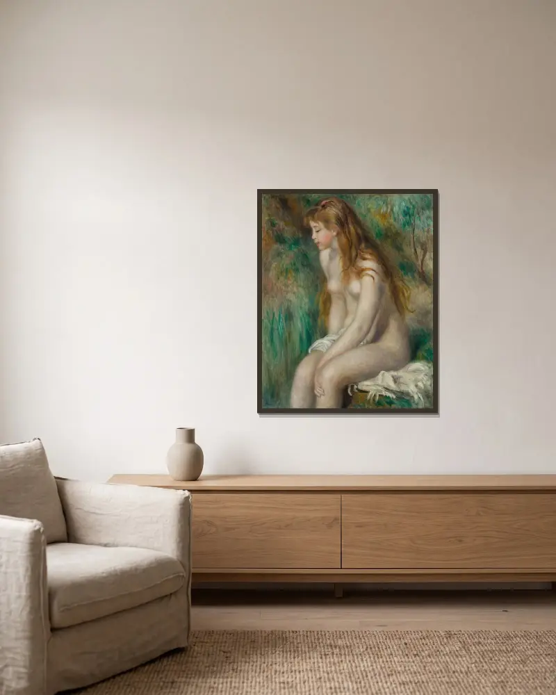 Badendes Mädchen von Pierre-Auguste Renoir gerahmt an einer Wand