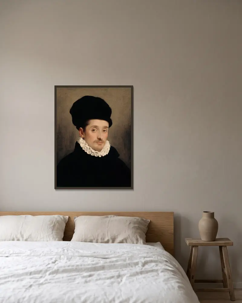 Portrait of a Man – nr 1 av Giovanni Battista Moroni inramad på en vägg