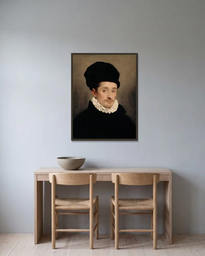 Portrait of a Man – nr 1 av Giovanni Battista Moroni inramad på en vägg