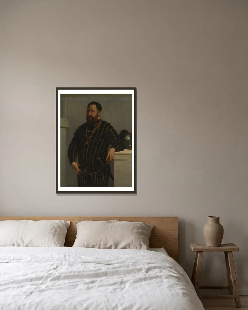 Portrait of a Man – nr 2 av Giovanni Battista Moroni inramad på en vägg