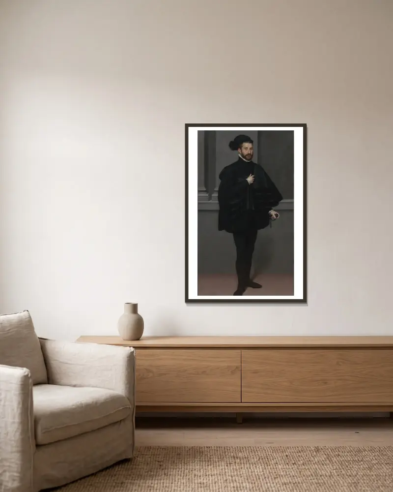 Der Ritter in Schwarz von Giovanni Battista Moroni gerahmt an einer Wand
