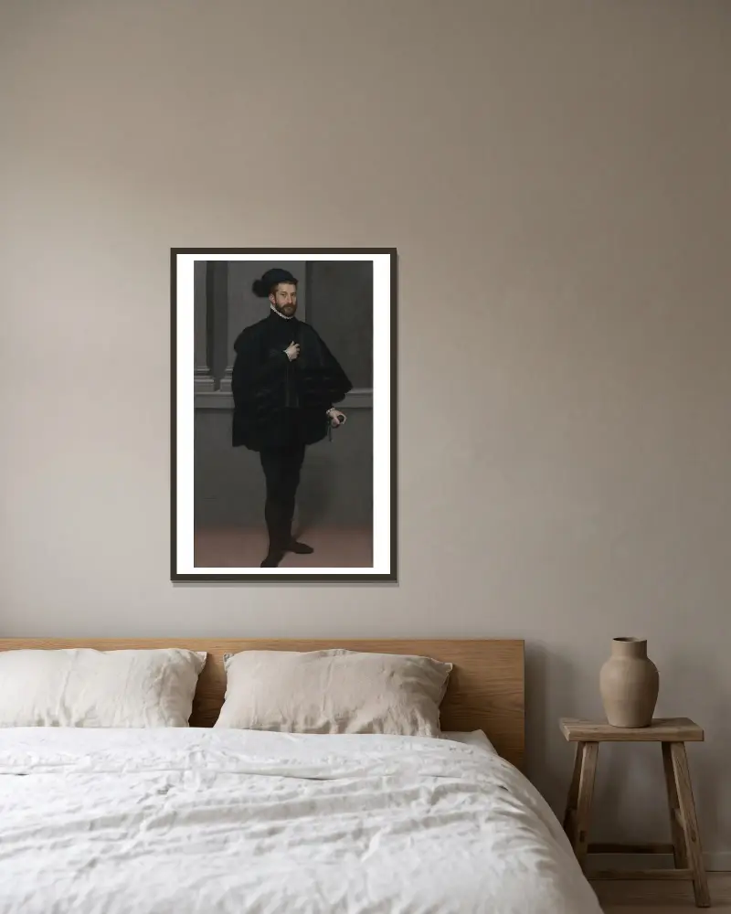 Der Ritter in Schwarz von Giovanni Battista Moroni gerahmt an einer Wand