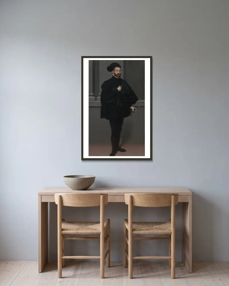 Der Ritter in Schwarz von Giovanni Battista Moroni gerahmt an einer Wand