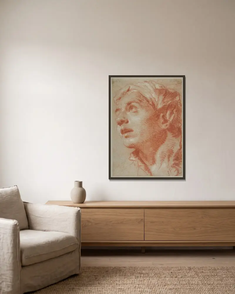 Huvud av ung man i trekvartsvy av Giovanni Battista Tiepolo inramad på en vägg