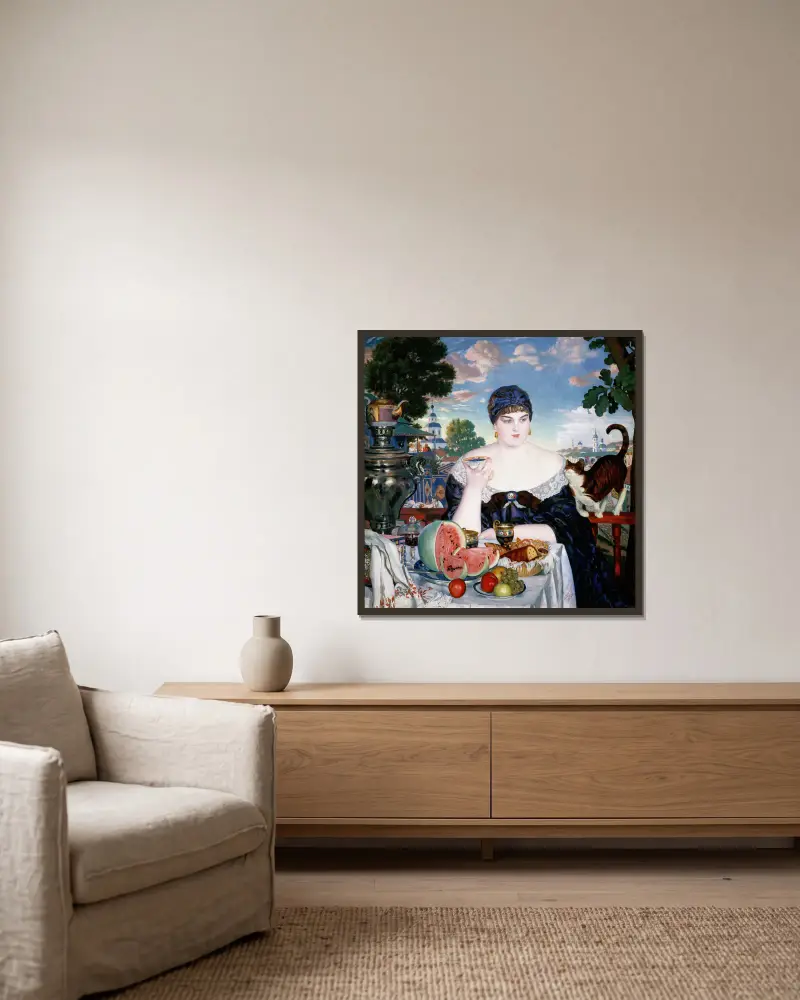 Kaufmannsfrau am Teetisch von Boris Kustodiev gerahmt an einer Wand