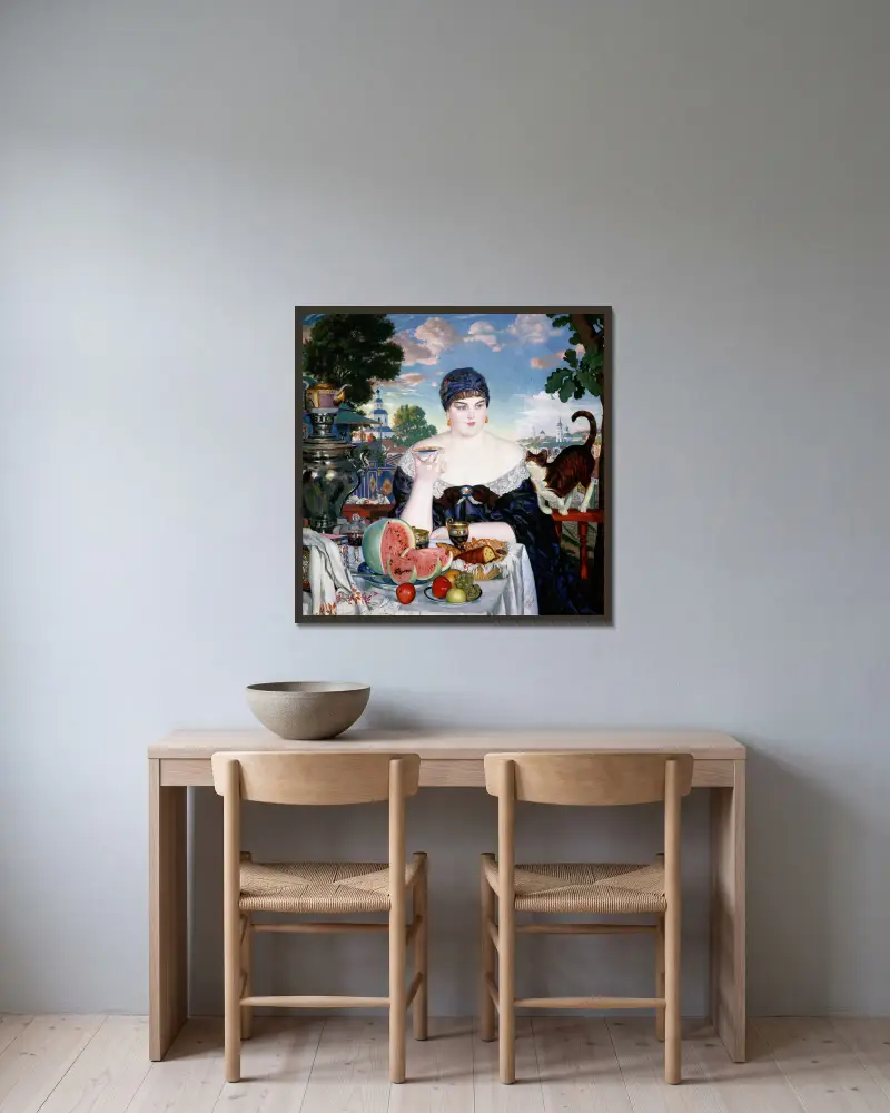 Kaufmannsfrau am Teetisch von Boris Kustodiev gerahmt an einer Wand