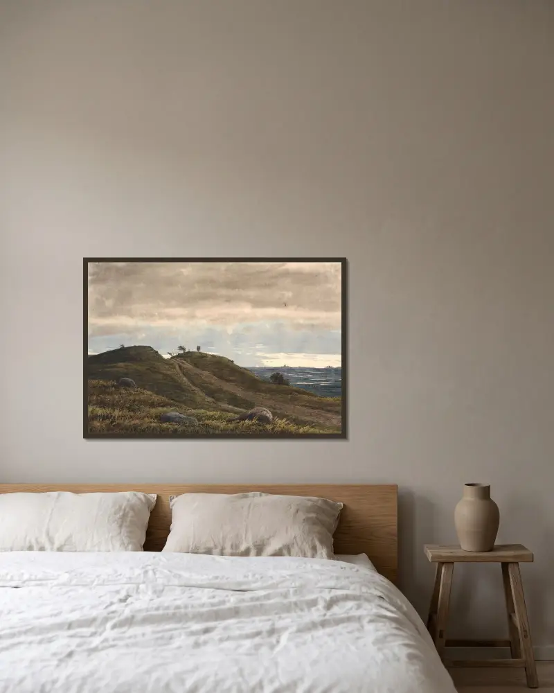 Landskap med sandig väg över en ljungbacke. Till höger utsikt över vidsträckt land med torvmossar. Från Raageleje-egnen av P. C. Skovgaard inramad på en vägg