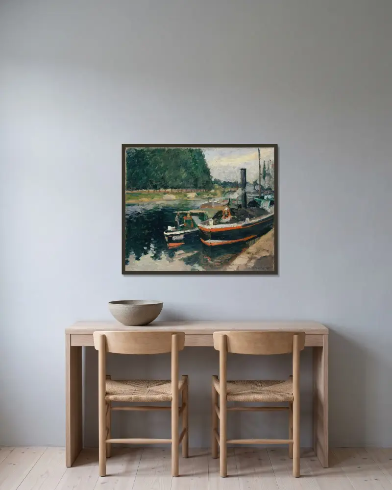Barges at Pontoise av Camille Pissarro inramad på en vägg