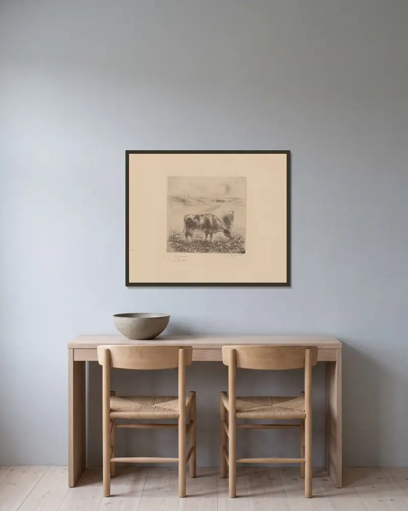 Die Kuh von Camille Pissarro gerahmt an einer Wand