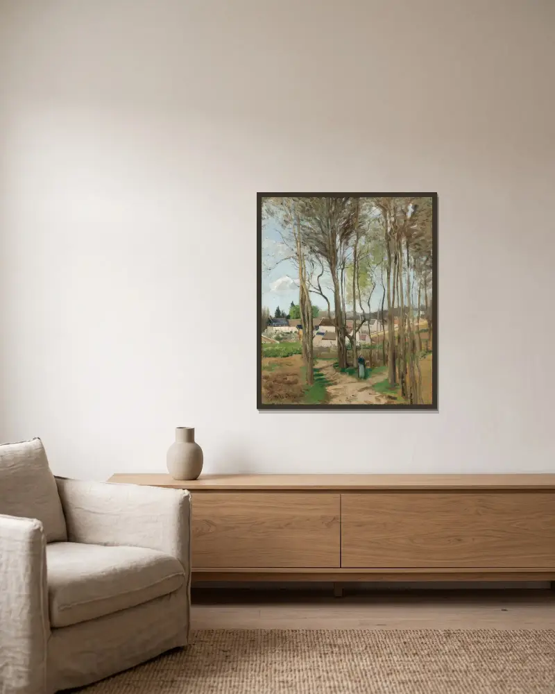 Le village à travers les arbres av Camille Pissarro inramad på en vägg