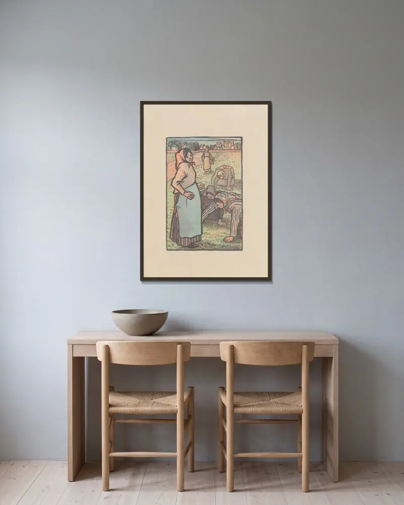 Die Jäterinnen von Camille Pissarro gerahmt an einer Wand