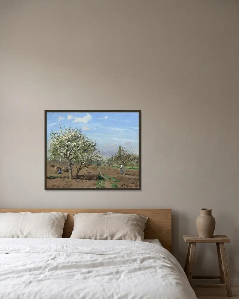 Orchard in Bloom,Louveciennes av Camille Pissarro inramad på en vägg