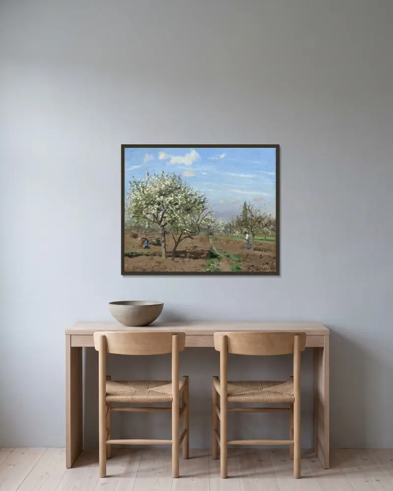 Orchard in Bloom,Louveciennes av Camille Pissarro inramad på en vägg