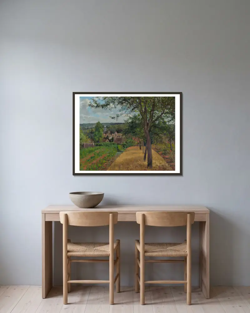 Orchards at Louveciennes av Camille Pissarro inramad på en vägg