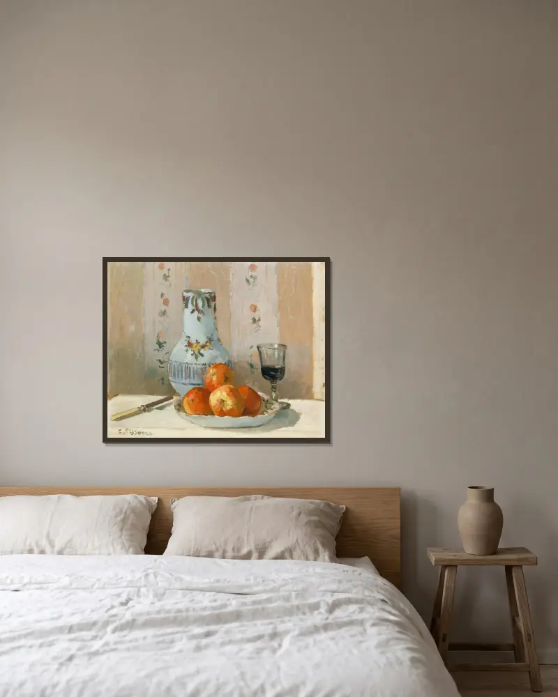 Still Life with Apples and Pitcher av Camille Pissarro inramad på en vägg