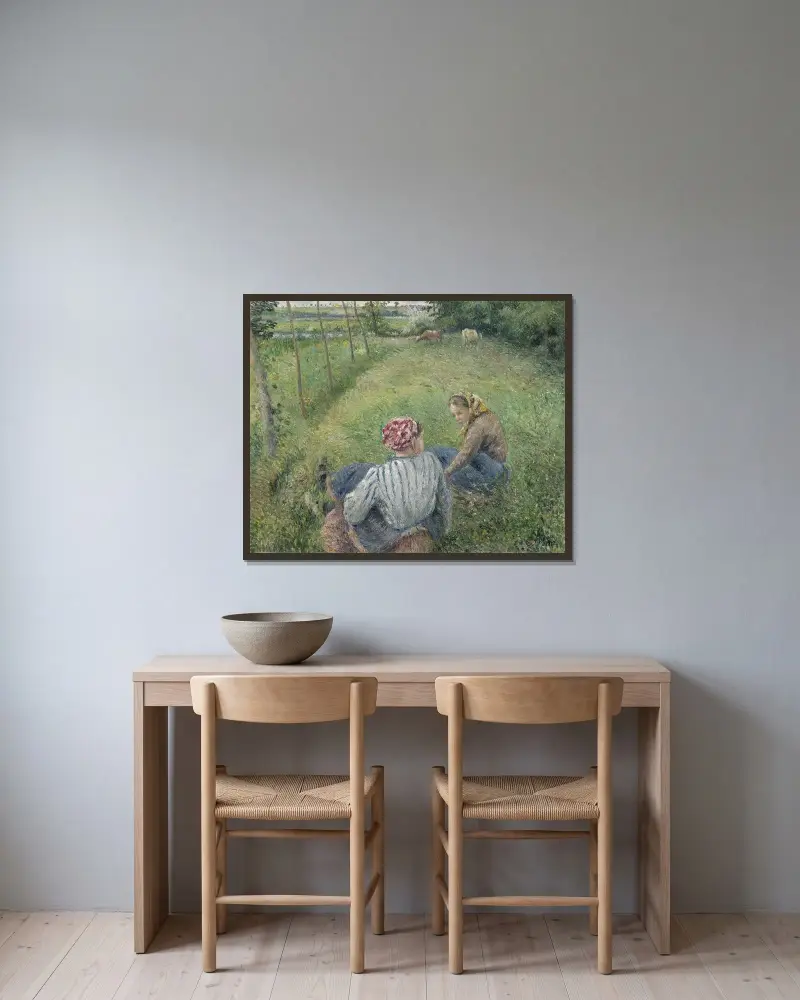 Young Peasant Girls Resting in the Fields near Pontoise av Camille Pissarro inramad på en vägg