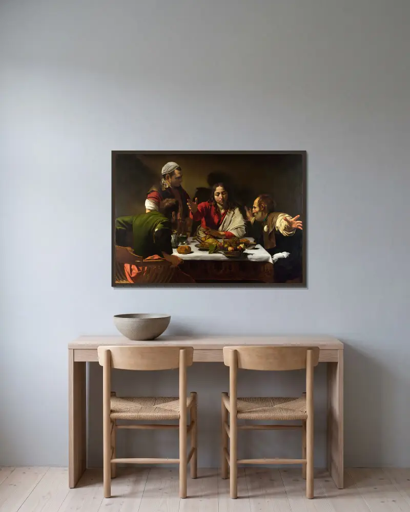 Das Abendmahl in Emmaus von Caravaggio gerahmt an einer Wand