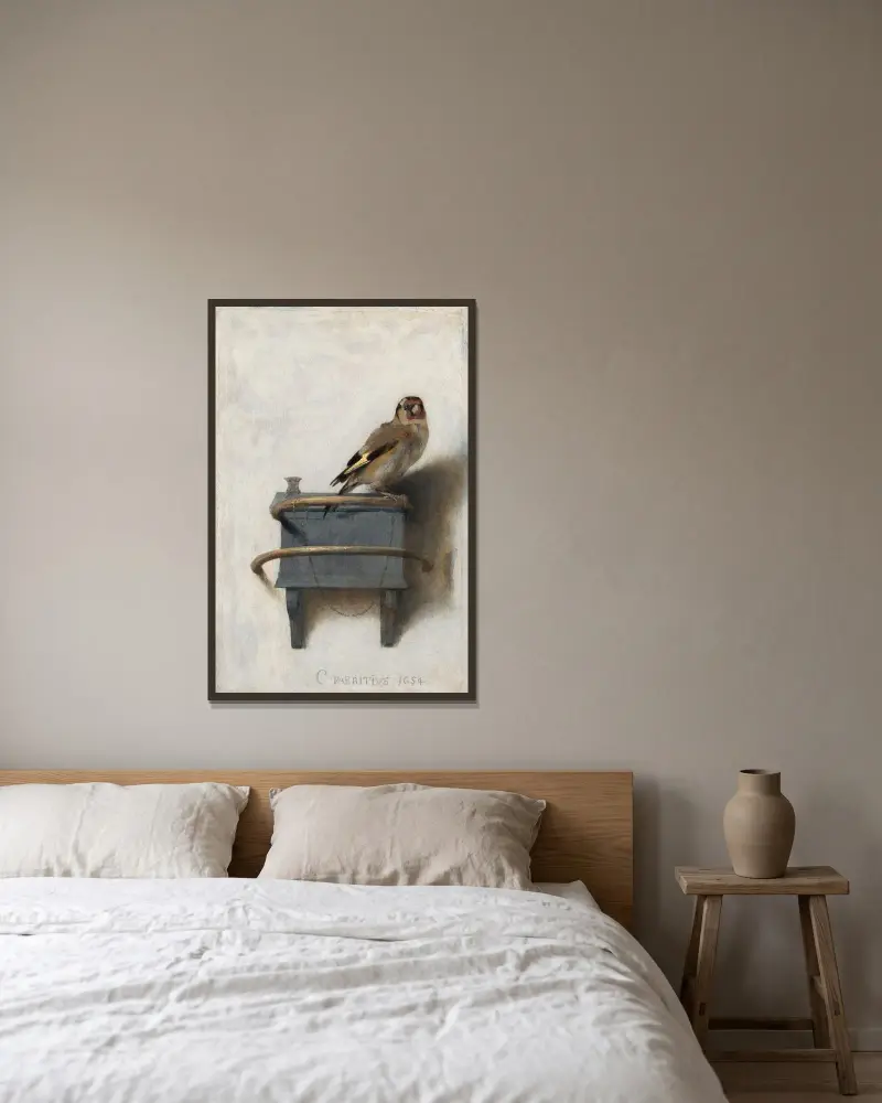 The Goldfinch av Carel Fabritius inramad på en vägg