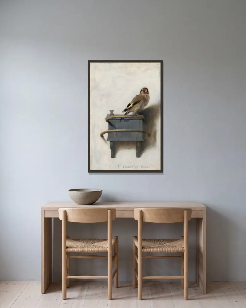 The Goldfinch av Carel Fabritius inramad på en vägg