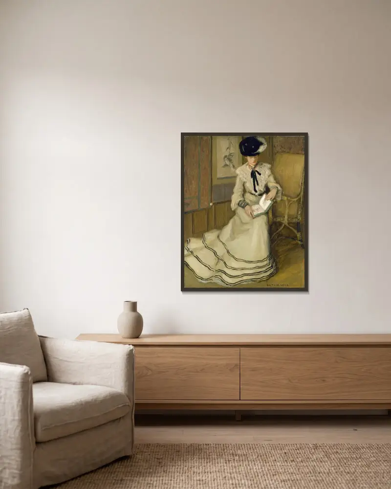 Flicka läsande av Frederick Carl Frieseke inramad på en vägg