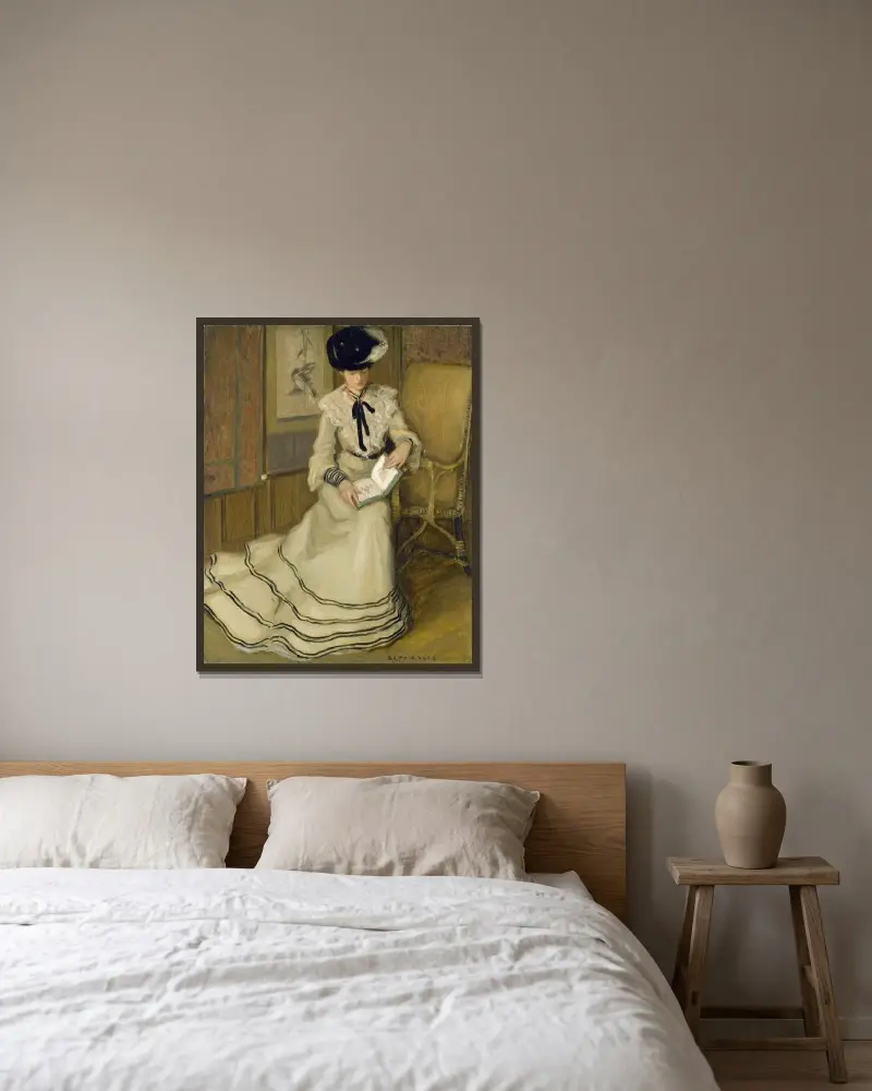 Flicka läsande av Frederick Carl Frieseke inramad på en vägg