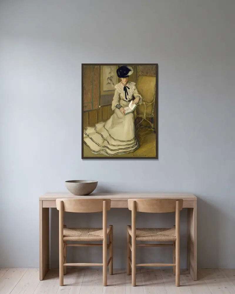 Flicka läsande av Frederick Carl Frieseke inramad på en vägg