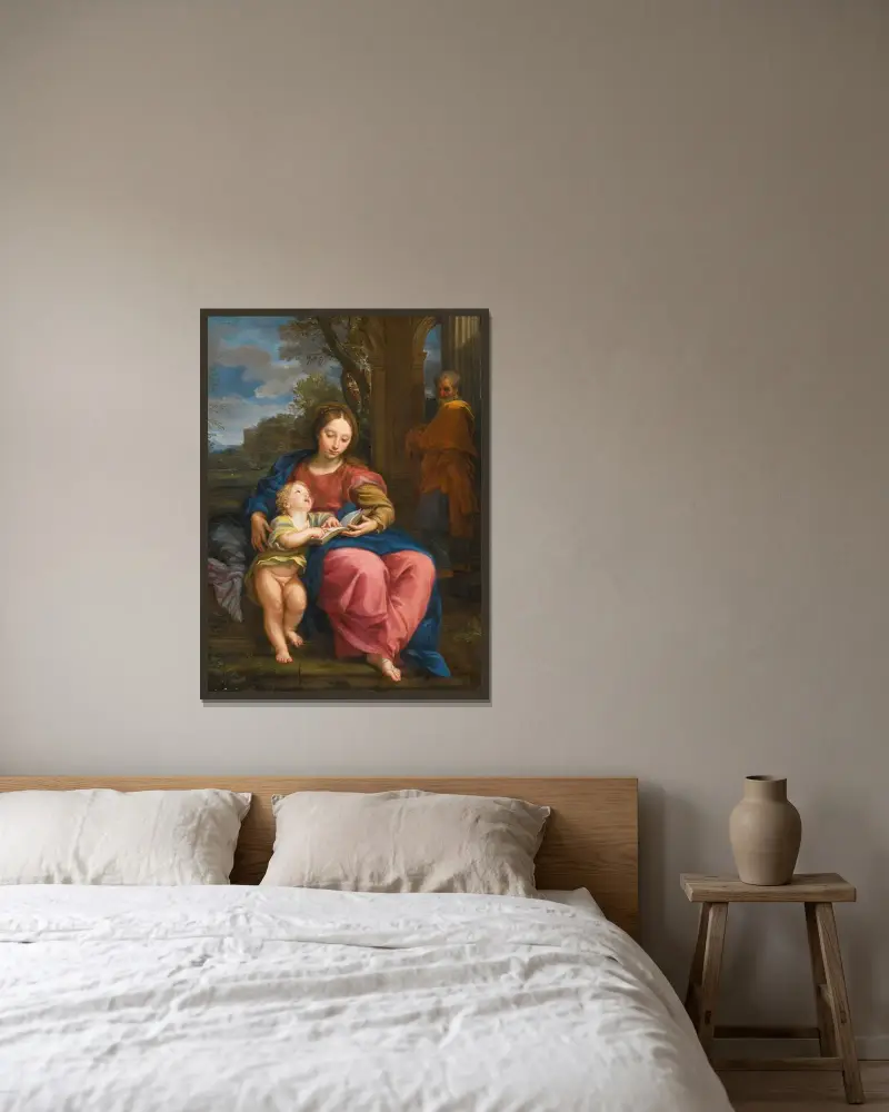 Den heliga familjen, madonnan och barnet läsande av Carlo Maratti inramad på en vägg