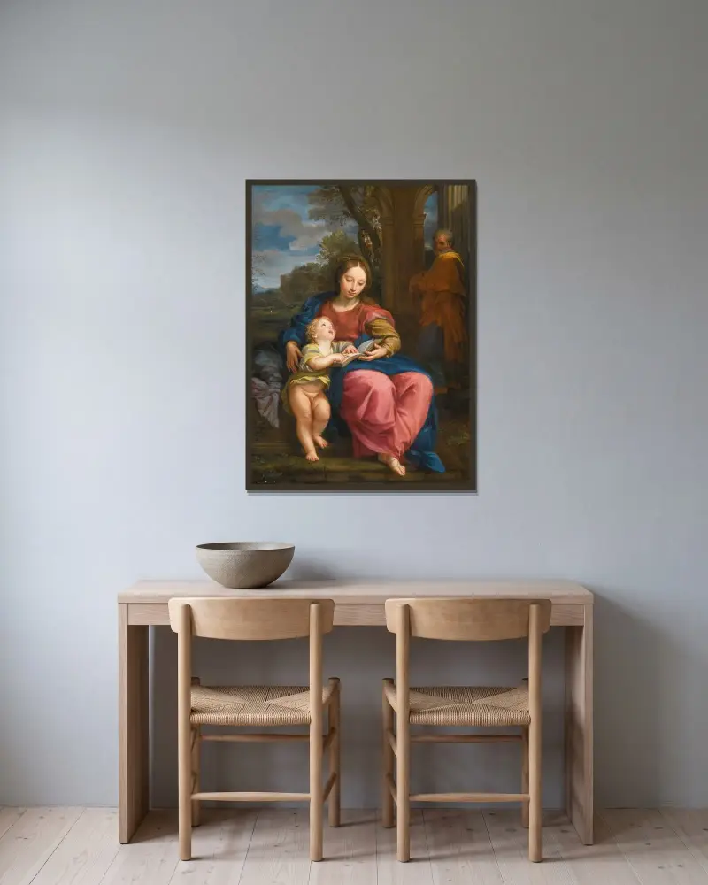 Den heliga familjen, madonnan och barnet läsande av Carlo Maratti inramad på en vägg
