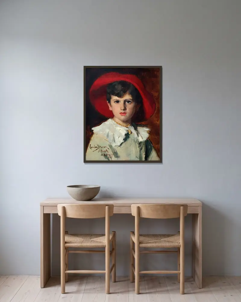 Barn i röd hatt (Michel Feydeau, son till Georges) av Carolus-Duran inramad på en vägg
