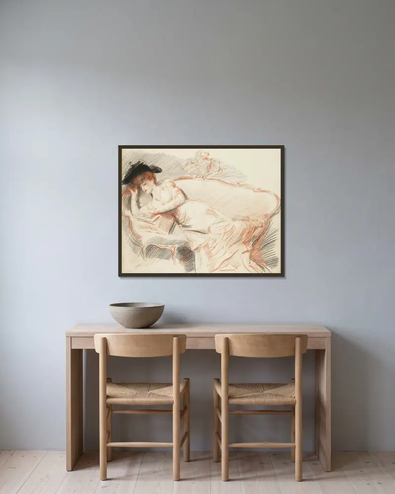 Elegant dam läsande i soffa av Paul César Helleu inramad på en vägg