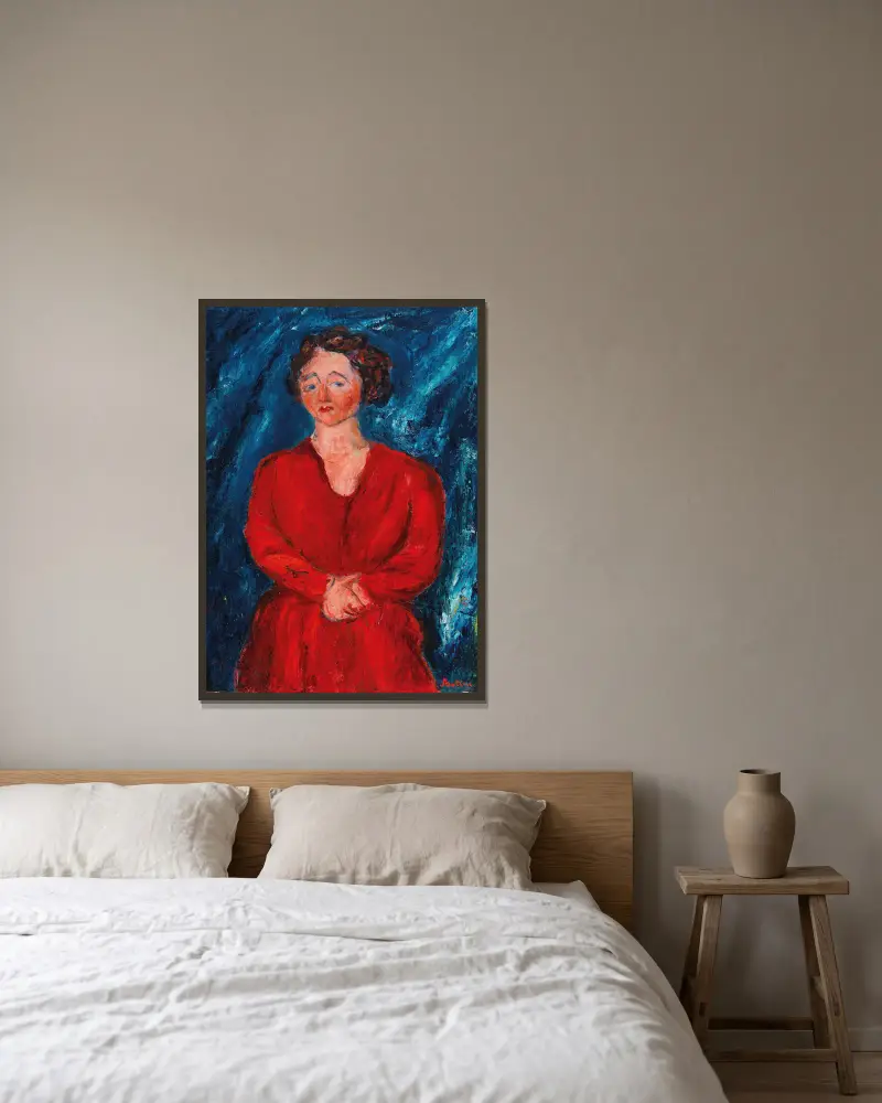 Kvinna i rött mot blå bakgrund av Chaïm Soutine inramad på en vägg
