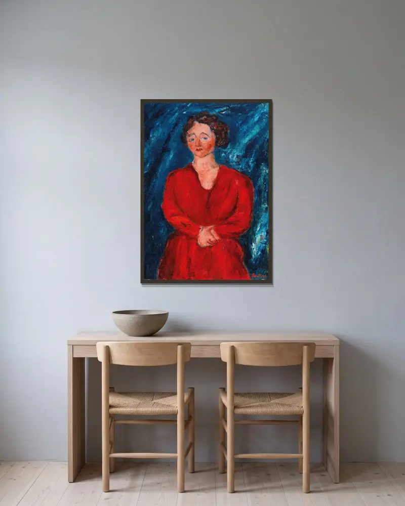 Kvinna i rött mot blå bakgrund av Chaïm Soutine inramad på en vägg