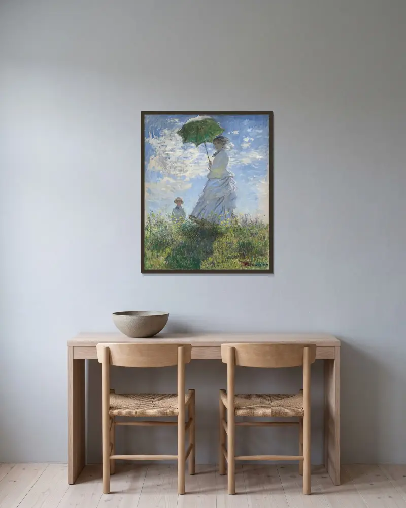 Kvinna med parasoll av Claude Monet inramad på en vägg