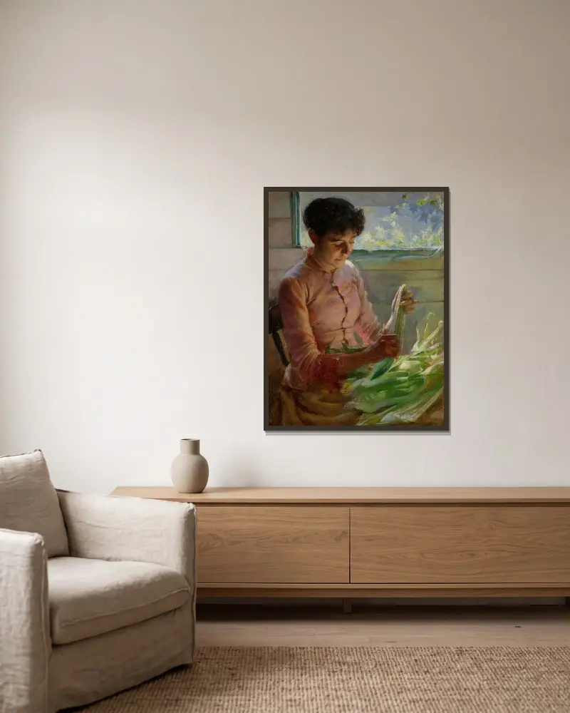 Maiskolben schälen von Charles Courtney Curran gerahmt an einer Wand