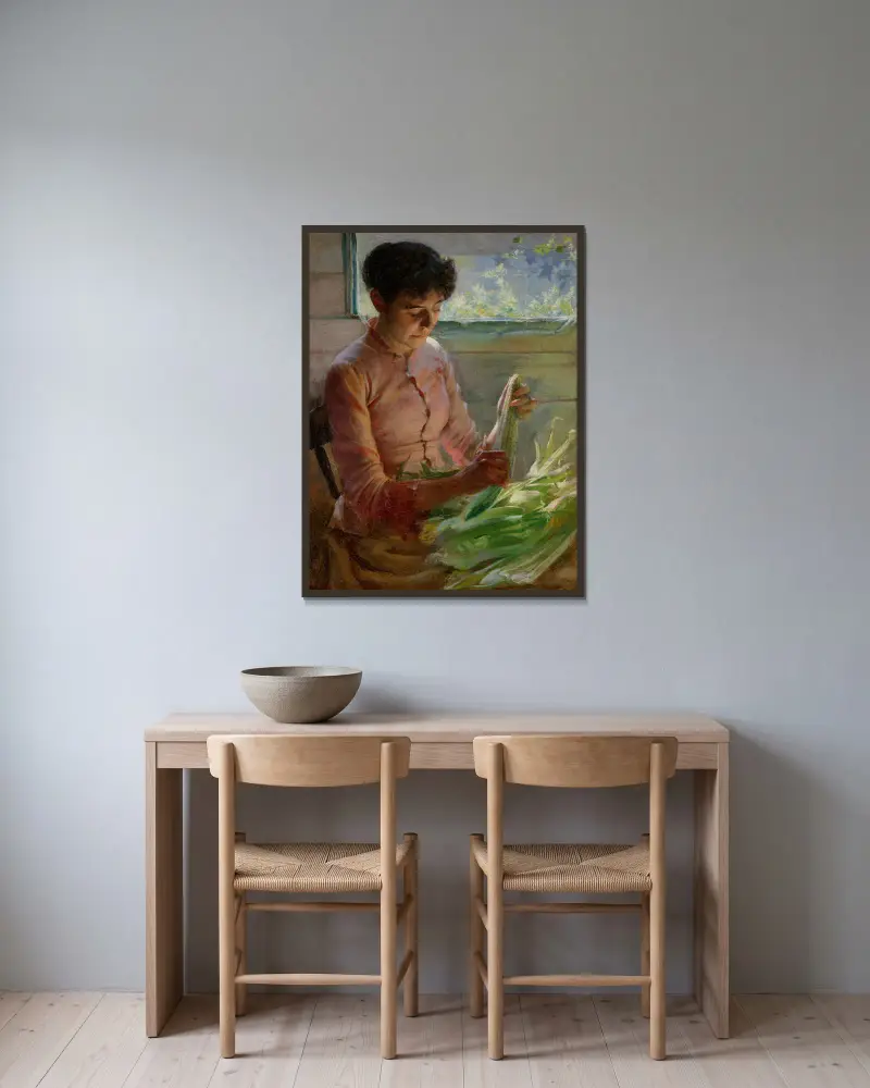 Maiskolben schälen von Charles Courtney Curran gerahmt an einer Wand